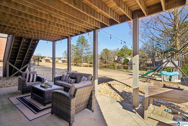 view of patio / terrace featuring a playground and an outdoor living space