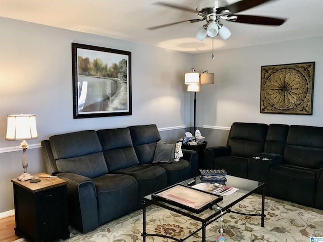 living room featuring light wood-type flooring and ceiling fan