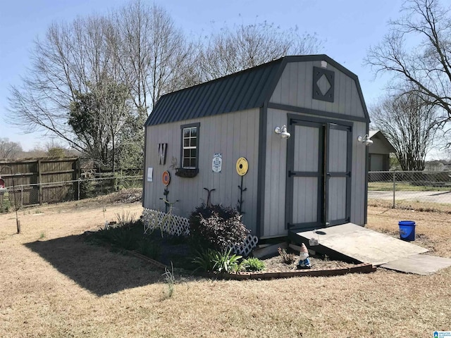 view of shed with fence