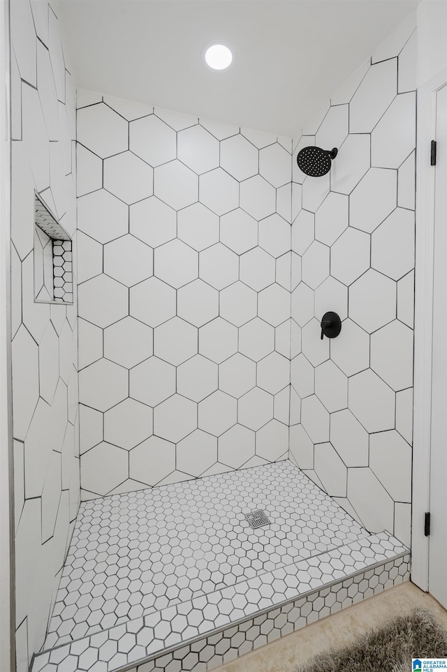 full bathroom with a tile shower