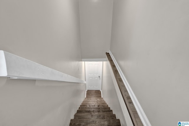 staircase with wood finished floors