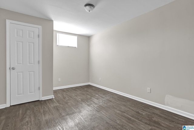 interior space with baseboards and wood finished floors