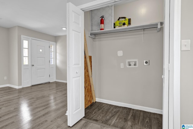 laundry area with laundry area, baseboards, wood finished floors, washer hookup, and electric dryer hookup