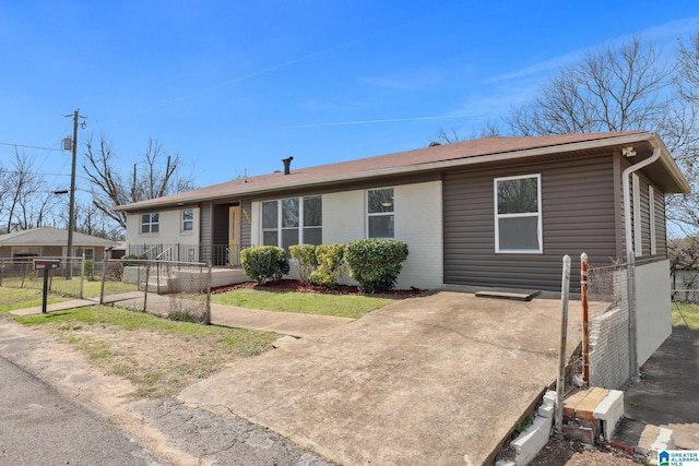 single story home featuring brick siding and fence