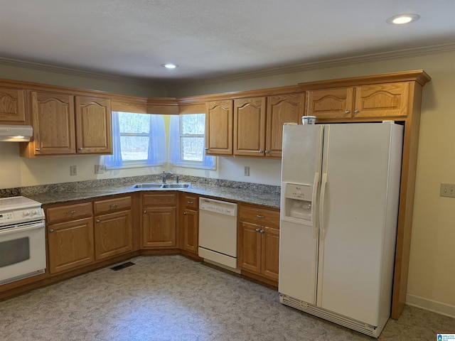 kitchen with under cabinet range hood, white appliances, a sink, visible vents, and brown cabinetry