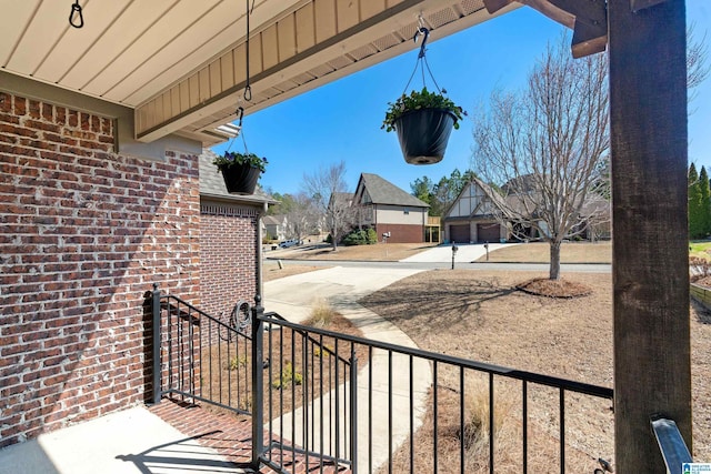 view of patio / terrace featuring a garage and driveway