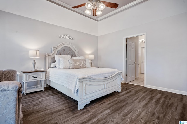 bedroom with wood finished floors, a ceiling fan, and baseboards