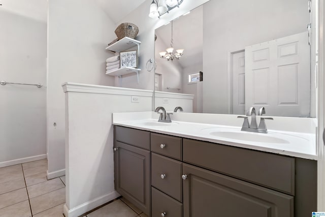 full bath with double vanity, a sink, and tile patterned floors