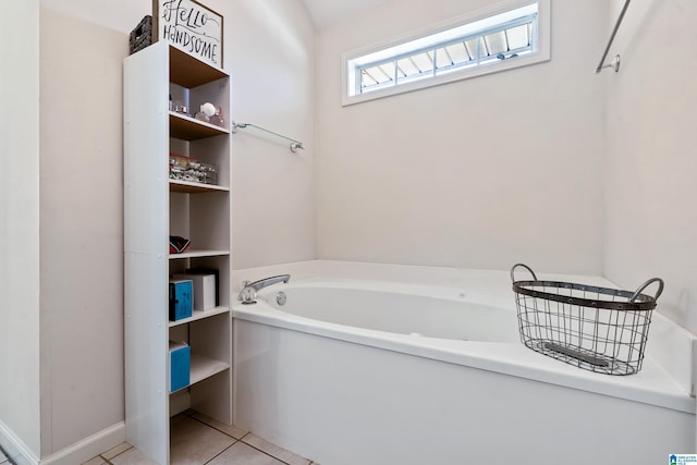 bathroom featuring a garden tub and tile patterned floors