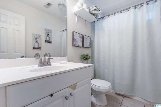 bathroom featuring curtained shower, tile patterned flooring, toilet, vanity, and visible vents