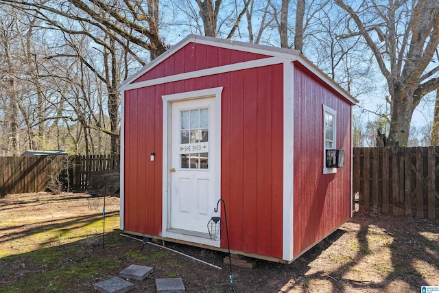 view of shed with a fenced backyard