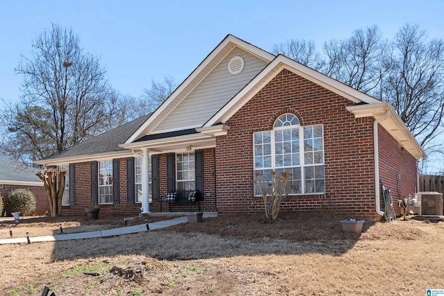 single story home with brick siding and central AC unit