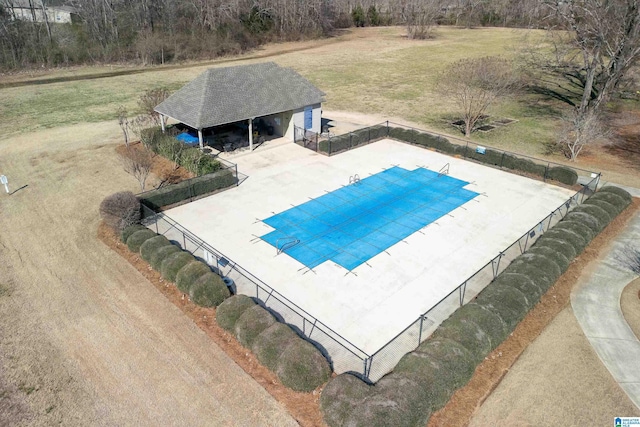 pool featuring a patio area and fence