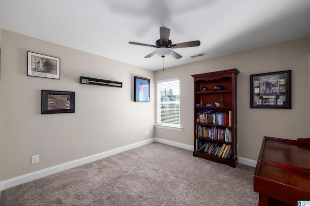 sitting room with carpet, visible vents, ceiling fan, and baseboards