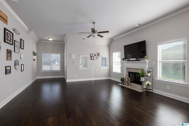 unfurnished living room featuring a fireplace, crown molding, visible vents, dark wood-type flooring, and baseboards