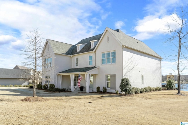 view of front of property with roof with shingles