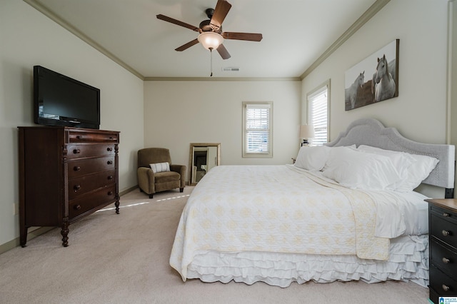 bedroom featuring light colored carpet, visible vents, crown molding, and baseboards