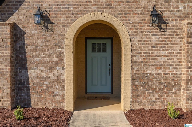 entrance to property with brick siding