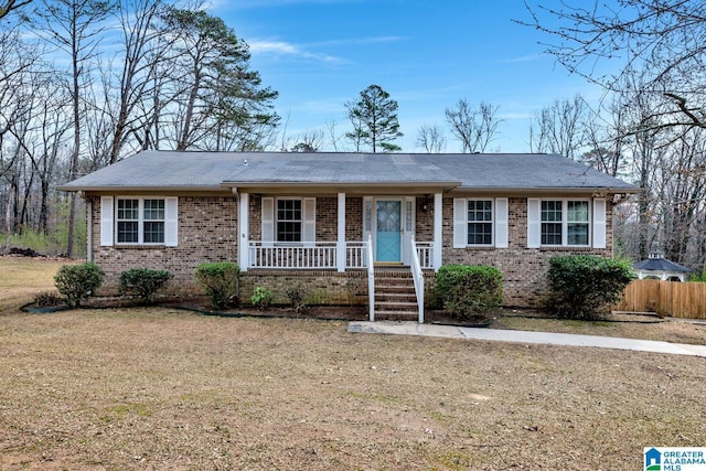 single story home with brick siding and a porch