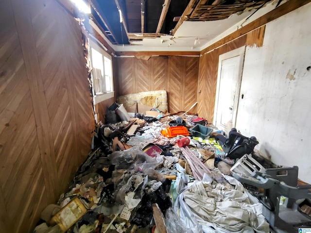 miscellaneous room featuring wooden walls