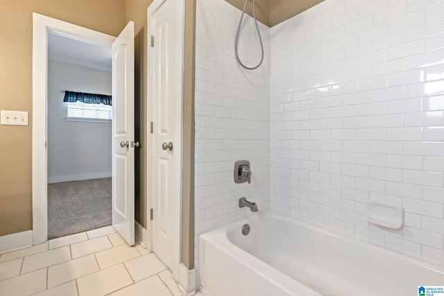 bathroom featuring shower / bath combination, tile patterned flooring, and baseboards