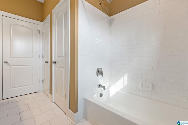 bathroom featuring  shower combination and tile patterned floors