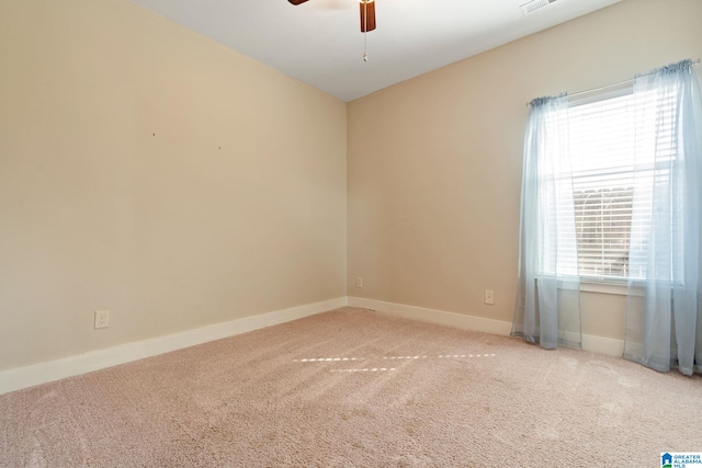 unfurnished room featuring ceiling fan, carpet, visible vents, and baseboards