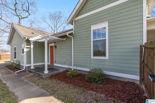 exterior space with fence and a pergola