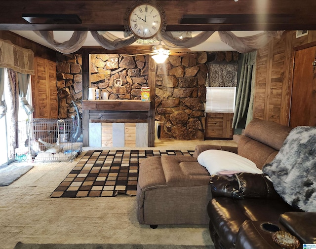 living area with wooden walls and carpet flooring