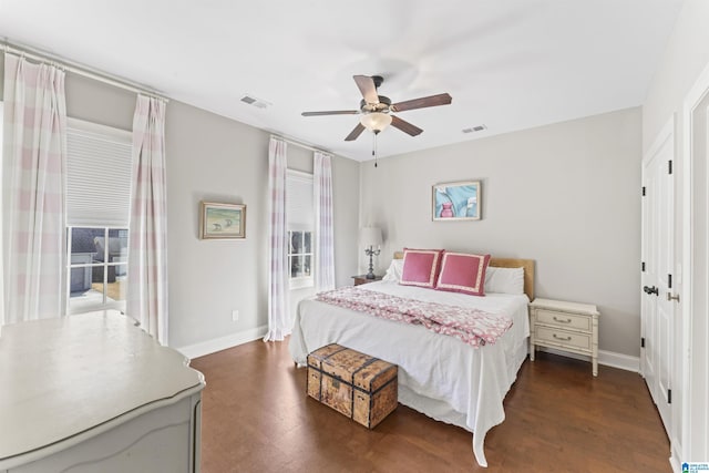 bedroom with a ceiling fan, visible vents, and baseboards