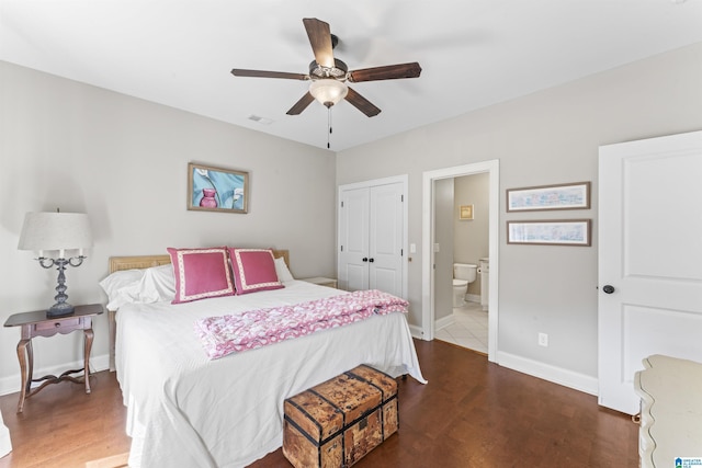 bedroom featuring visible vents, baseboards, a ceiling fan, ensuite bathroom, and a closet