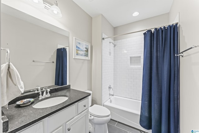 bathroom featuring toilet, tile patterned flooring, shower / bath combination with curtain, and vanity