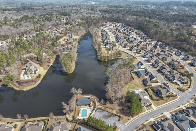 drone / aerial view featuring a water view and a residential view