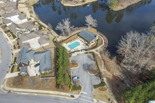 drone / aerial view featuring a residential view and a water view