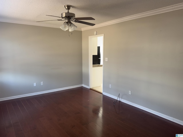 unfurnished room with crown molding, a textured ceiling, baseboards, and wood finished floors