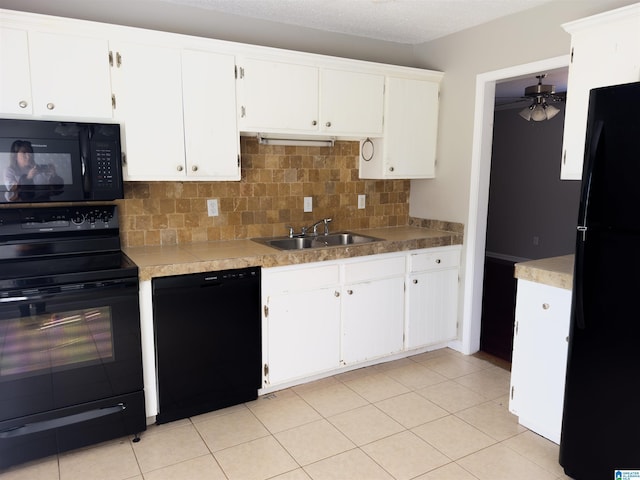 kitchen with decorative backsplash, a ceiling fan, white cabinetry, a sink, and black appliances