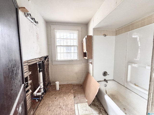 full bath featuring shower / washtub combination