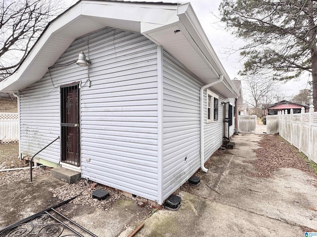 view of side of home with fence