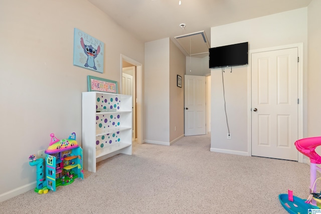 game room featuring carpet floors, attic access, and baseboards