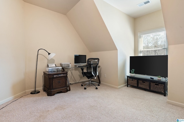 carpeted home office featuring visible vents, vaulted ceiling, and baseboards