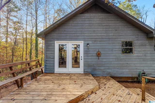 back of house featuring a wooden deck