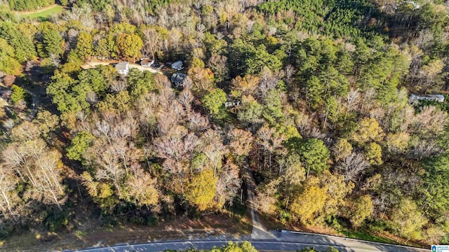 birds eye view of property with a wooded view