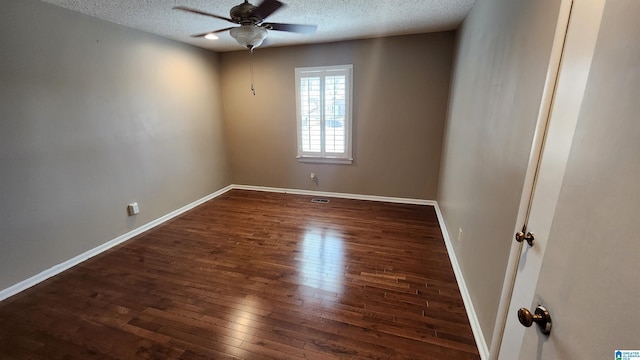 empty room featuring a ceiling fan, a textured ceiling, baseboards, and hardwood / wood-style floors