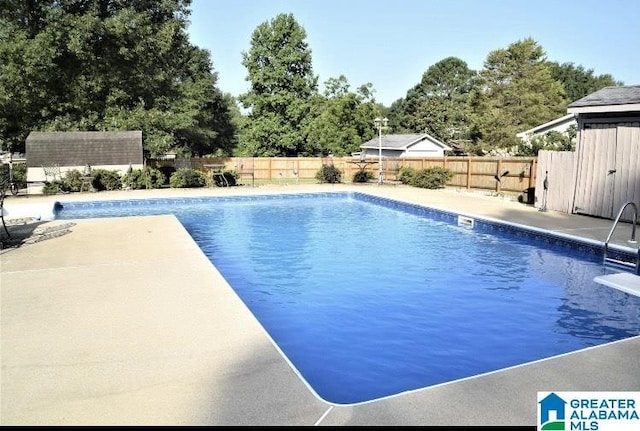 view of pool with a fenced in pool, a fenced backyard, and a patio