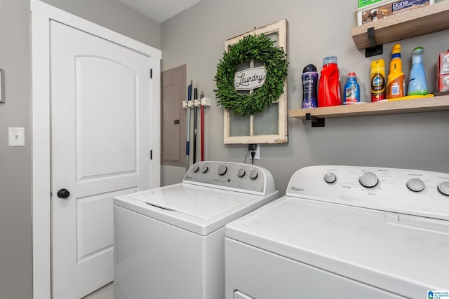 clothes washing area featuring laundry area, electric panel, and independent washer and dryer