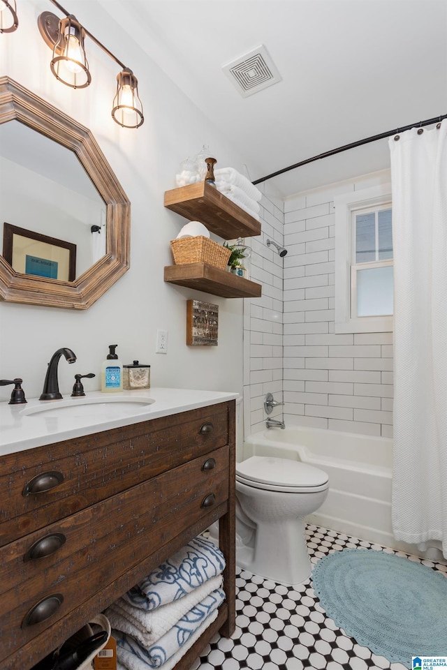 full bath featuring toilet, shower / bath combo, visible vents, and vanity