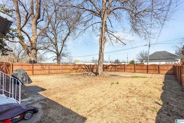 view of yard with a fenced backyard