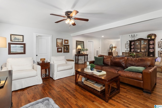 living area with ceiling fan and wood finished floors