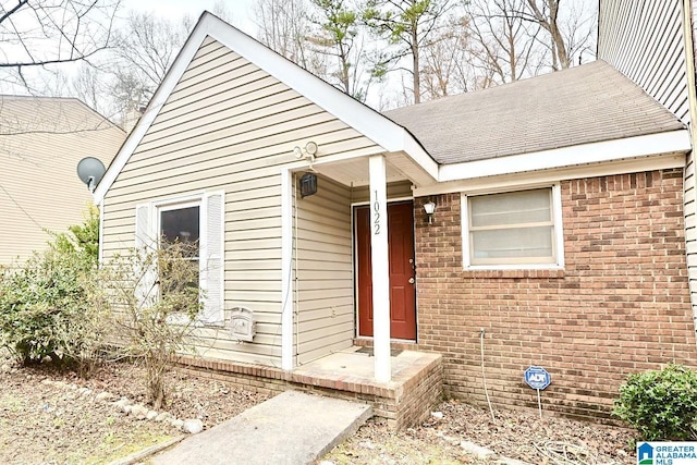 view of front of house with brick siding