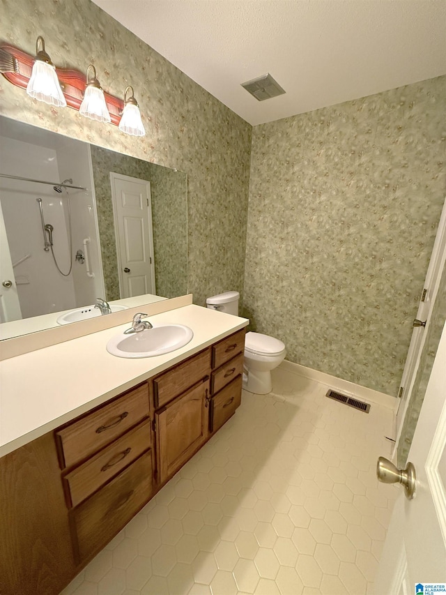 full bath with toilet, wallpapered walls, visible vents, and tile patterned floors